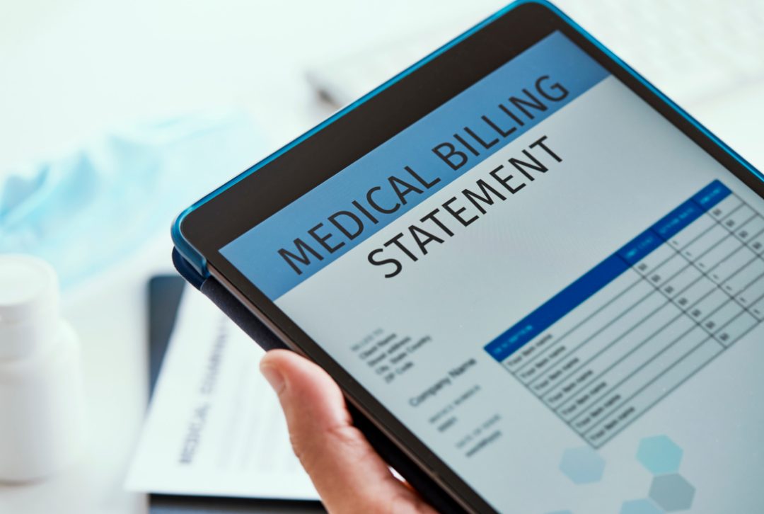 patient looking at an online medical billing statement